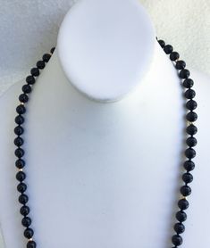 "A Truly Stunning Asian Hand Knotted Black Jade And 14k Beaded Necklace With A 10k Gold Charm From Wausau Attached Next To The 14k Interlocking Clasp In Superb Vintage Condition. The vintage statement necklace is all original and free of any damage of any kind. The black Jade beads are 1/4\" in diameter with hand knotting in between. The 14k gold beads measure 1/8\" in diameter. The 14k gold interlocking clasp is also marked with a hallmark of the maker. The necklace is 27\" in total length. Thi Classic Gold Hand-strung Necklace, 14k Gold Single Strand Jewelry With Round Beads, Formal Yellow Gold Beaded Necklace, Elegant Polished Yellow Gold Beads, Elegant Formal Hand-strung Beads, Elegant Yellow Gold Polished Beads, Elegant 8mm Rondelle Beaded Necklaces, 14k Gold Round Beads Jewelry, Formal 14k Gold Jewelry With Polished Beads