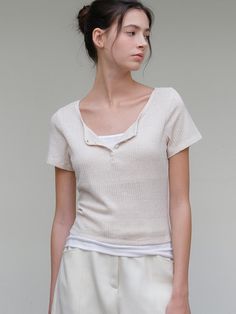 This is a minimal and feminine top by ourcomos that is made out of high quality and sturdy material. With distinctive mood of the design and comfortable wear, you can use it for your daily lifestyle.- Knit-like boucle fabric with soft touch- Slim fit with elasticity- Four button cosure on neckline Soft Knit V-neck Top, Cream Knit Tops For Loungewear, White Relaxed Fit Top With Soft Texture, White Tops With Soft Texture And Relaxed Fit, Beige Relaxed Fit Top With Soft Texture, Relaxed Fit Knit Tops With Soft Texture, Soft Textured Knit Tops For Layering, Casual Spring Top With Soft Texture, Casual Spring Tops With Soft Texture