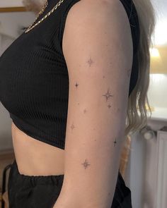 Fineline Stars Tattoo on Upper Arm - A Delicate and Timeless Design Upper Arm Line Tattoo, Star Tattoos On Shoulder Woman, Small Tattoo Cluster, Stars Around Tattoo, Arm Stars Tattoo, Made Of Stars Tattoo, Back Of Arm Star Tattoo, Upper Arm Star Tattoo, Star Half Sleeve Tattoo