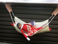 an elf is sitting in a hammock