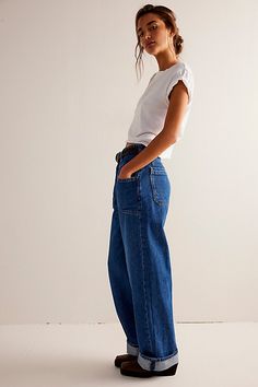 A true wear-everywhere pair from our We The Free collection, these jeans will be a staple in your denim drawer from this season to the next. **Fit:** Mid-rise, relaxed wide-leg silhouette **Features:** Zip fly and button closure, seamed pouch pockets, yoking for added shape, button detailing at the waistband, cuffed hemlines **Why We ❤ It:** The perfect elevated touch to a classic silhouette, pair these with sleek boots or sporty sneakers for endless ways to wear. | We The Free Palmer Cuffed Jea Tunnel Vision, Sporty Sneakers, All Jeans, Toddler Boots, Long Sleeve Kids, Cuffed Jeans, Dress With Boots, Boho Outfits, Long Tops