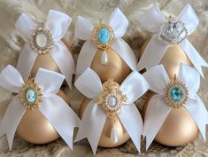 six eggs with bows and jewels on them