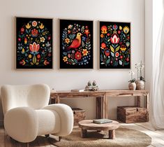 there are two paintings on the wall in this living room, one is decorated with flowers and birds