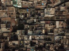 an aerial view of many old buildings in the middle of a city with lots of windows and doors