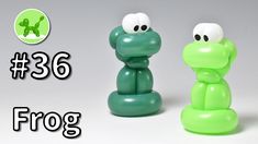 two green and white plastic toys sitting next to each other