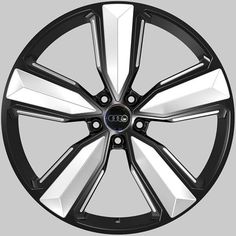 an image of a black and white wheel on a gray background with the word audi written in