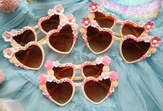 What's more adorable than our Mama and Mini Bloom Sunnies! Giving the word twinning a whole lot of vibes. Please note that flower charms are subject to stock. Pick the flower colors for the bigger ones to be at the corner and the rest of the flowers will be randomly selected unless a request is placed in the personalisation box. Not to worry, designs are always adorable. The pair contains of: an adult heart sunny, and A matching mini heart sunny that will best fit little ones up to 6 YO What you Cute Customizable Sunglasses For Beach, Customizable Cute Summer Sunglasses, Cute Personalized Summer Sunglasses, Cute Customizable Sunglasses For Gift, Personalized Pink Sunglasses For Beach, Customizable Pink Sunglasses For The Beach, Spring Gift Sunglasses With Gradient Lenses, Spring Gift Sunglasses With Tinted Lenses, Spring Tinted Sunglasses As Gift