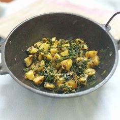 a pan filled with food sitting on top of a table