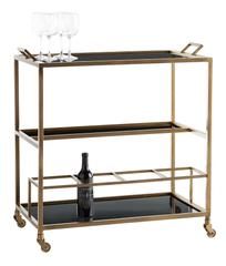 a gold and black bar cart with two wine glasses on the bottom shelf next to a bottle of wine