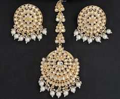 Make every celebration spectacular with our exquisite white color Kundan Maang Tikka with Clustered Pearl Drops Earrings Set! Elevate your look with this stunning set, perfect for weddings and traditional wear. Kundan earrings / Kundan Chandbali / Indian Earrings / Pearl earrings / Maang tikka earring combo set / PRODUCT VARIATIONS - We strive to present each product with utmost accuracy and detail. However, due to the photography process, the item size may seem bigger or smaller than it actuall Kundan Maang Tikka, Maang Tikka Kundan, Kundan Chandbali, Earring Combo, Earrings Kundan, Maang Tikka, Kundan Earrings, Indian Earrings, Earrings Pearl