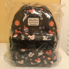 Brand New Disney Parks Halloween Loungefly Backpack Disney-styled Black Standard Backpack, Black Disney Backpack For Halloween, Halloween Themed Travel Backpack, Themed Backpack For Everyday Use And Halloween, Themed Halloween Travel Backpack, Black Disney Backpack For Travel, Disney Halloween Backpack For Disney Trips, Themed Black Backpack For Everyday Use, Black Backpack For Halloween Travel