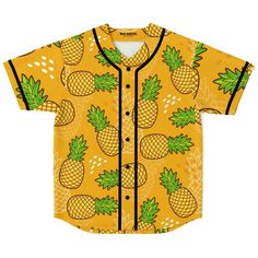 a yellow shirt with pineapples on it