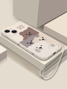 an iphone case with two bears on it and a cord attached to the phone's back