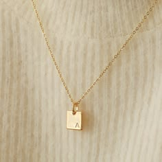 "This dainty gold necklace will be your new go-to minimalist pendant necklace! Personalize it with your or your loved one's initial - we stamp it for you. Made out of high quality gold plated & gold filled materials and perfect for everyday wear. It is an excellent layering necklace and is great as a gift for your friends and yourself! Other Personalized Necklaces: https://www.etsy.com/shop/AyouJewelry?section_id=31672095 D E T A I L S * 16K gold plated pendant * 14K gold filled necklace --- Gold Sentimental Initial Necklace, Cheap Minimalist Initial Necklace For Personalized Gift, Cheap Sentimental Initial Pendant Necklace, Initial Pendant Necklace Relationship, Affordable Minimalist Initial Necklace As Personalized Gift, Gold Necklace For Boyfriend, Gold Pendant Designs Modern, Square Gold Pendant, Gold Engraved Necklace