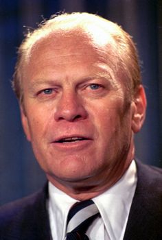 an older man wearing a suit and tie