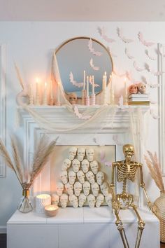 a living room decorated with candles and skeleton figurines