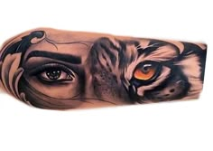 a tiger's face with an orange eye and black lines on the upper half of it