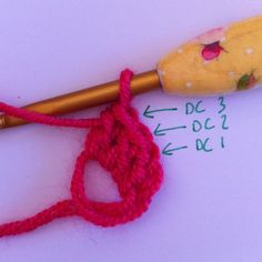 the crochet hook is next to an umbrella