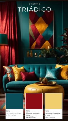 a living room with blue couches, red curtains and gold accents on the walls