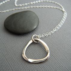 sterling silver mobius strip necklace small math mathematical sculpture geometric dainty delicate simple modern jewelry contemporary 3/4" A really cool mobius strip necklace....perfect unique piece for every day. - A solid sterling silver mobius sculpture charm, measuring 3/4" across at widest point.  - Necklace chain is 1.5 mm cable chain, length customizable at drop down menu. Lobster clasp and locking jump rings, all solid sterling silver. - Very shiny....dark marks on the pendant in the pict Modern Sterling Silver Infinity Necklace, Sculpture Geometric, Mobius Strip, Sterling Silver Cleaner, Necklace Packaging, Top Rings, Jewelry Model, Geometric Necklace, Geometric Jewelry