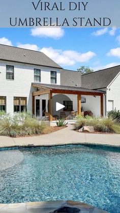 a large white house with a pool in front of it and the words virtual diy umbrella