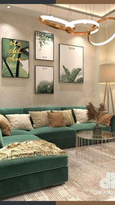 a living room with green couches and pictures on the wall