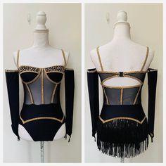 the back of a black leotard with gold beading and fringes on it