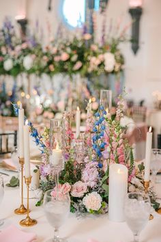 a table with candles and flowers on it