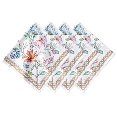 four napkins with flowers and chains on the front, one is white and three are gold