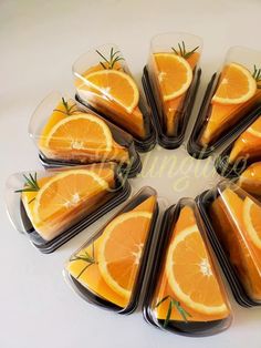 orange slices are arranged in a circle on top of each other with rosemary sprigs