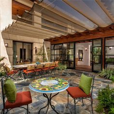 an outdoor patio with seating and tables