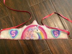 a unicorn headband with the letter s on it