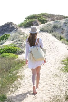 Our Woven Sisal and Leather Tote is chic and casual perfection. Made from sturdy woven cream colored sisal giving it structure with timeless leather straps. This roomy tote is the perfect size for your daytime outings. Roomy enough for a lightweight beach towel and a good book or for toting your laptop along with your daily necessities. Handwoven in Kenya with cream sisal fiber and leather. Cream Straw Bag With Braided Handles For Day Out, Cream Beach Bag For Spring Travel, Chic Cream Beach Bag For Beach Season, Chic Cream Beach Bag, Everyday Sand-colored Straw Tote Bag, Cream Straw Bag With Adjustable Strap For Travel, Natural Coastal Beach Bag For Everyday Use, Casual Canvas Straw Bag For Summer, Summer Travel Straw Bag With Canvas Material