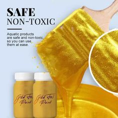 two bottles of gold dust next to a wooden spatula with the words safe non - tonic on it