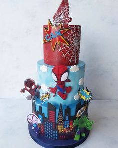 a spiderman themed birthday cake on a table