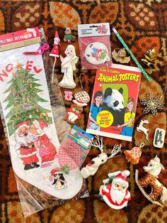 various christmas items are laid out on the floor next to a book and pencils