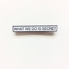 what we do is secret sticker on a white surface