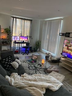 a living room filled with furniture and a flat screen tv