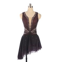 a dress on a mannequin with sequins and beads in the back