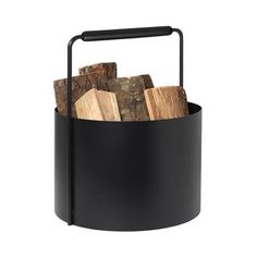 a black metal bucket filled with logs