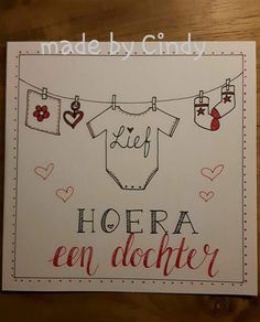 a card with clothes and hearts hanging on a line that says hoera en diaper