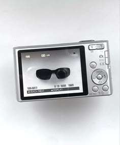 a digital camera with sunglasses on the screen