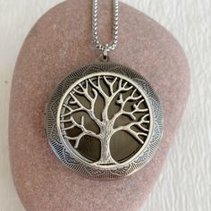 "The tree of life symbolizes life and the interconnections of the universe to sustain life. Timeless and classic, this gorgeous antiqued silver locket will become a special addition to your jewelry collection. This locket is extra large at 46mm in diameter, silver plated brass and opens for a secret place to keep pictures, messages, or whatever you like. The interior of the locket where a photo fits is 30mm. It can fit two photos. This locket is embossed on both sides and is lightweight and comf Spiritual Locket Necklace For Keepsake, Personalized Silver Nature-inspired Jewelry, Spiritual Engraved Oval Pendant Locket Necklace, Spiritual Engraved Oval Locket Necklace, Bohemian Silver Locket Necklace With Round Pendant, Spiritual Keepsake Round Pendant Locket Necklace, Handmade Spiritual Locket Necklace For Keepsake, Silver Tree Of Life Round Pendant Necklace, Spiritual Silver Metal Locket Necklace