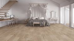 a bedroom with white walls and wood flooring next to a staircase leading up to a bed