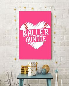 a pink poster with the words baller annie on it next to presents and decorations