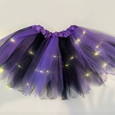 3-Layered Ballet Tutu With Led Lights. The Battery Is With On/Off Switch In 1 Small Plastic Box Inside The Skirt. The Led Lights Last Long. The Lights Looks Bright And Awesome At Night, And Gives A Great Illumination Of The Skirt. The Waist Band Is Elastic And It's Easy On And Off, And Can Fit A Variety Of Shapes And Sizes. Satin Covered Waistband For Added Comfort. Fits For 2-7 Years Kids. No Lining. Purple Skirt For Halloween Costume Party, Purple Tutu Skirt, French Toast School Uniforms, Red Tulle Skirt, Girls Pinafore, Halloween Skirt, Purple Tutu, Toddler Skirt, White Tennis Skirt