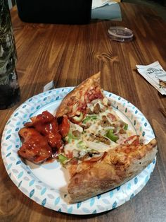 two slices of pizza on a paper plate