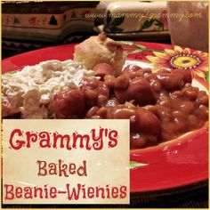 a red plate topped with beans and rice