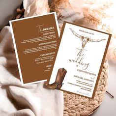 a wedding card with a cow skull on the front and back, sitting next to a wicker basket