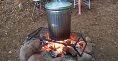 a trash can sitting on top of a fire pit